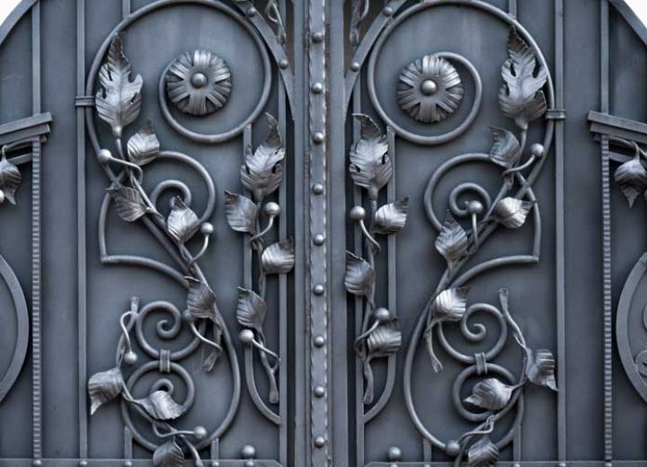 close up of a metal gate with forged design