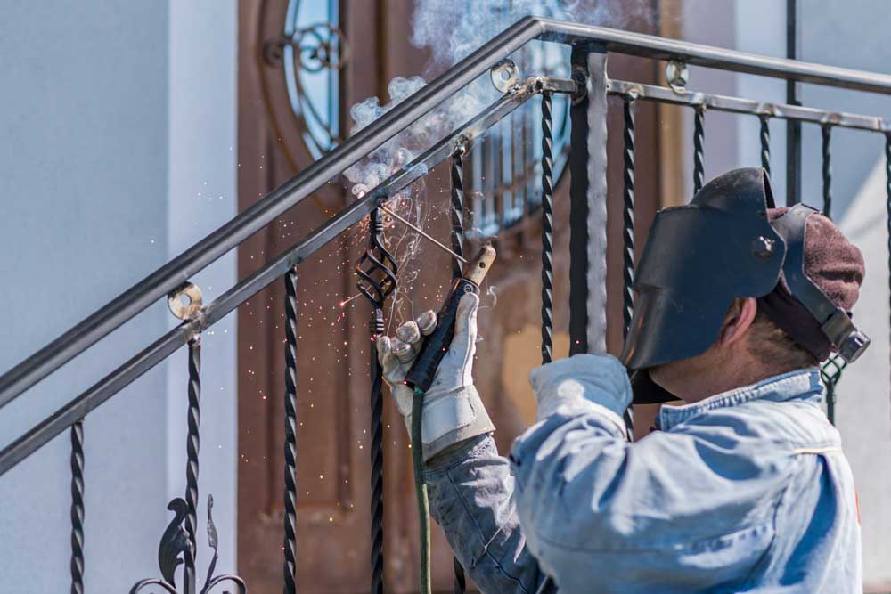close up of a metal gate with forged design