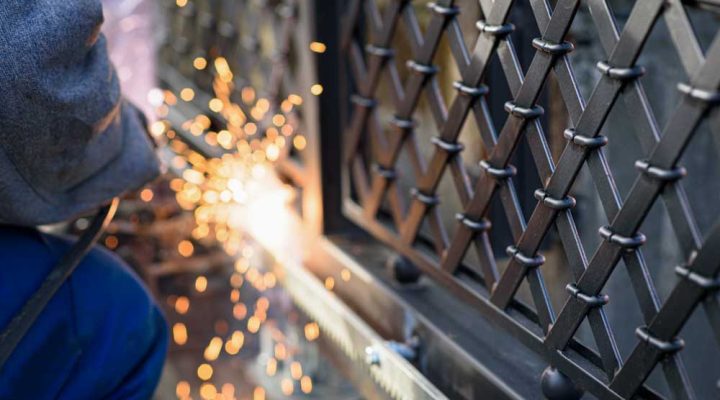 Welding the steel gear racks to the gate, professional service of installation and maintenance of automatic cantilever sliding gate
